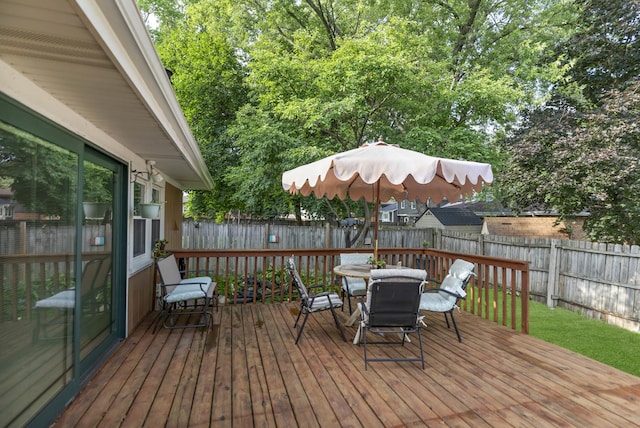 7 Walnut Dr, North Aurora, IL 60542 - wooden terrace with outdoor dining area and a fenced backyard