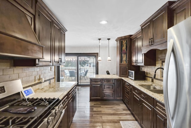 7 Walnut Dr, North Aurora, IL 60542 - kitchen featuring appliances with stainless steel finishes, custom exhaust hood, dark brown cabinetry, dark wood-style floors, and tasteful backsplash