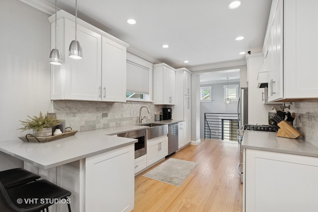 6848 N Oriole Ave, Chicago, IL 60631 - kitchen featuring stainless steel dishwasher, gas range oven, white cabinetry, recessed lighting, and decorative backsplash