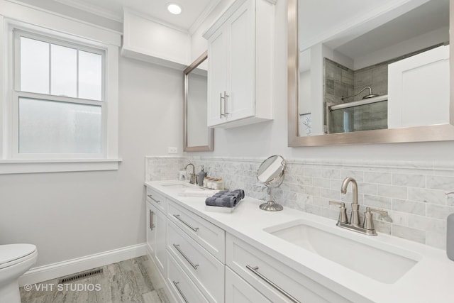 6848 N Oriole Ave, Chicago, IL 60631 - full bath featuring double vanity, a tile shower, backsplash, wood finished floors, and ornamental molding