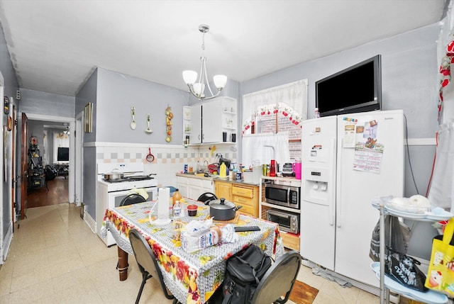 1916 N Lowell Ave, Chicago, IL 60639 - kitchen with white appliances, a chandelier, open shelves, backsplash, and light countertops