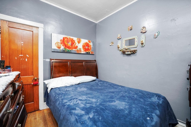 1916 N Lowell Ave, Chicago, IL 60639 - bedroom featuring wood finished floors and crown molding