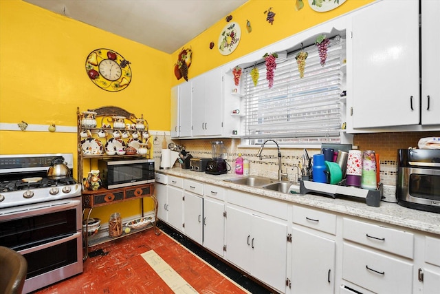 1916 N Lowell Ave, Chicago, IL 60639 - kitchen with range with two ovens, tasteful backsplash, white cabinetry, and light countertops