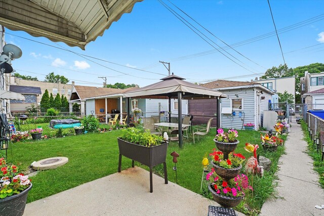 1916 N Lowell Ave, Chicago, IL 60639 - view of yard featuring a gazebo, a patio, and an outbuilding