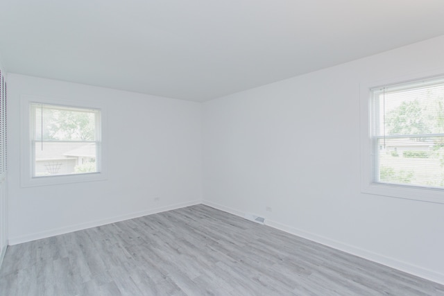 815 Concord Cv, Hoffman Estates, IL 60192 - spare room with light wood-style flooring and healthy amount of natural light