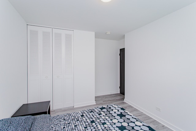 815 Concord Cv, Hoffman Estates, IL 60192 - unfurnished bedroom with light wood-style flooring and a closet