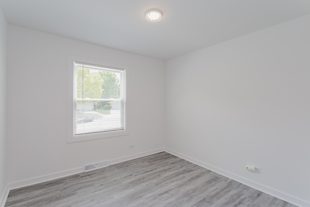 815 Concord Cv, Hoffman Estates, IL 60192 - spare room featuring light wood-type flooring and baseboards