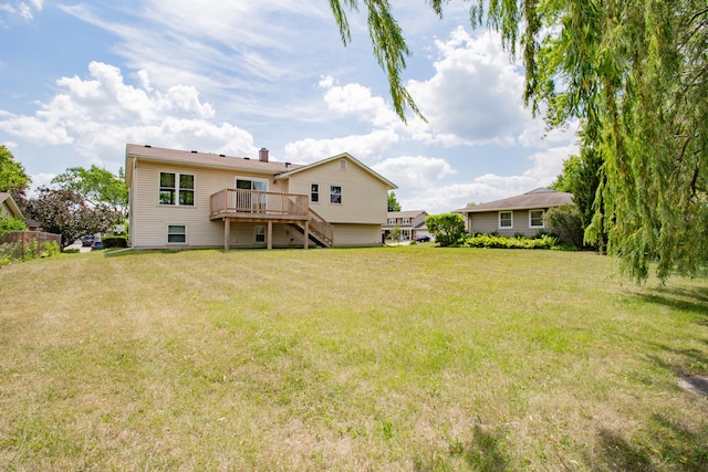 815 Concord Cv, Hoffman Estates, IL 60192 - back of house featuring a wooden deck, a lawn, stairs, and a chimney