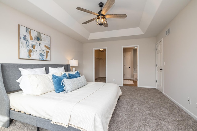 25030 Round Barn Rd, Plainfield, IL 60585 - bedroom with a raised ceiling, a walk in closet, carpet floors, a closet, and ensuite bath