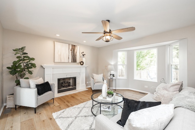 25030 Round Barn Rd, Plainfield, IL 60585 - living area with light wood-style flooring, ceiling fan, a high end fireplace, and recessed lighting