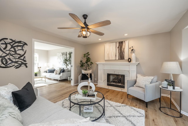 25030 Round Barn Rd, Plainfield, IL 60585 - living room featuring a ceiling fan, recessed lighting, light wood-type flooring, and a high end fireplace