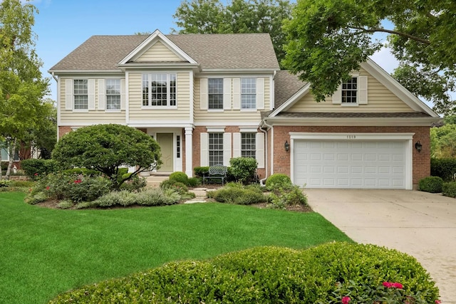 1219 N Lakeview Ct, Palatine, IL 60067 - view of front of property with brick siding, driveway, a front yard, and a garage
