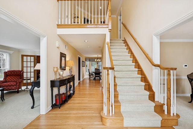 1219 N Lakeview Ct, Palatine, IL 60067 - foyer featuring healthy amount of natural light, stairway, wood finished floors, ornamental molding, and a towering ceiling