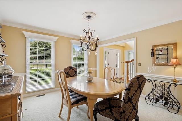 1219 N Lakeview Ct, Palatine, IL 60067 - dining area featuring carpet floors, a chandelier, and ornamental molding