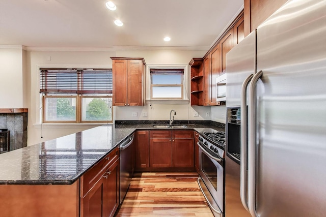 1634 N Wolcott Ave Unit 3, Chicago, IL 60622 - kitchen featuring stainless steel appliances, ornamental molding, light wood finished floors, open shelves, and dark stone countertops
