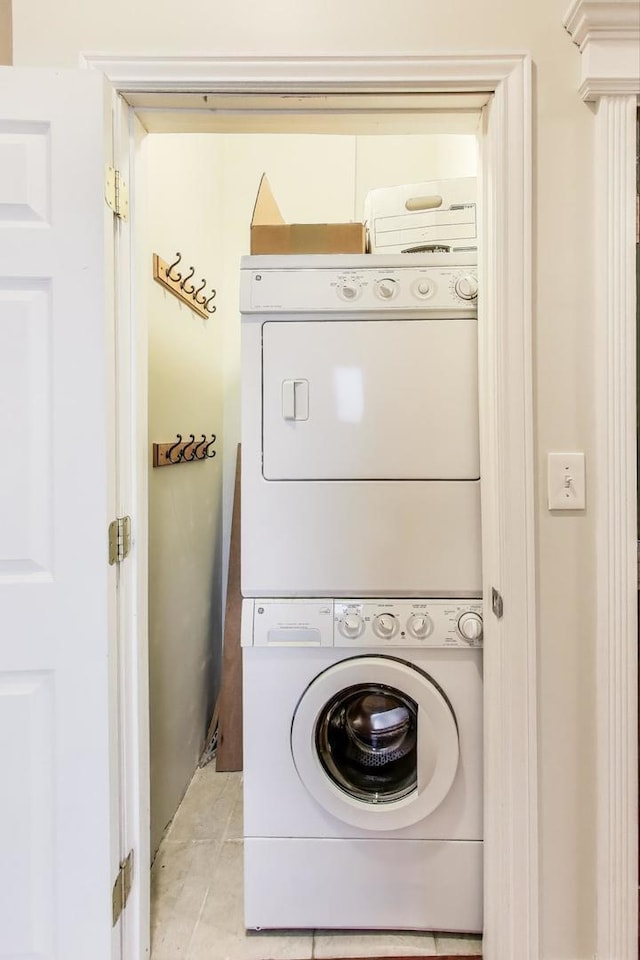 1634 N Wolcott Ave Unit 3, Chicago, IL 60622 - laundry room featuring stacked washer and clothes dryer and tile patterned floors