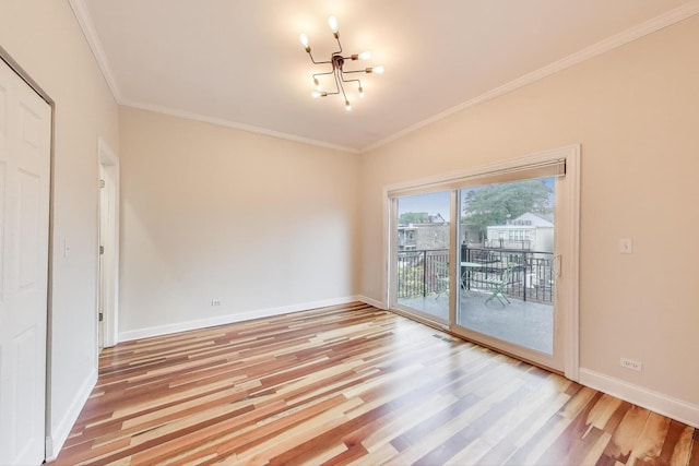 1634 N Wolcott Ave Unit 3, Chicago, IL 60622 - empty room featuring a chandelier, light wood-style floors, and crown molding
