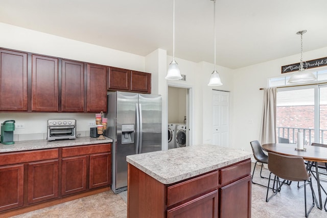 15373 Sheffield Square Pkwy, Orland Park, IL 60462 - kitchen featuring stainless steel refrigerator with ice dispenser, washing machine and dryer, light countertops, pendant lighting, and a kitchen island