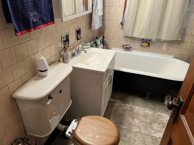 4721 W Warwick Ave, Chicago, IL 60641 - full bath with a freestanding tub, tile walls, vanity, and decorative backsplash