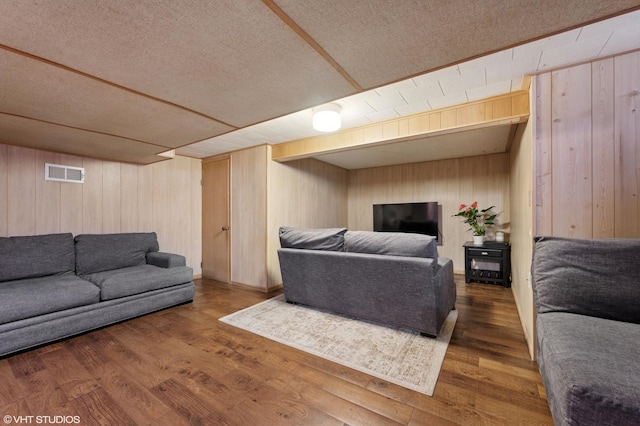 8301 N Waukegan Rd, Niles, IL 60714 - living room with wood walls, wood finished floors, and a textured ceiling