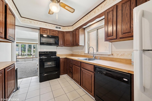 8301 N Waukegan Rd, Niles, IL 60714 - kitchen with black appliances, light countertops, ceiling fan, and light tile patterned floors
