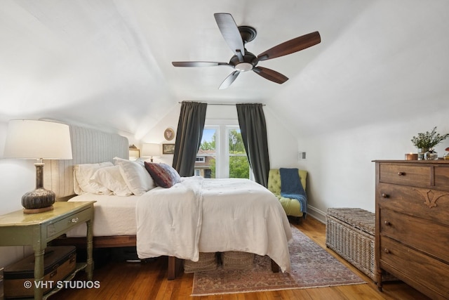 5747 W Grace St, Chicago, IL 60634 - bedroom featuring wood finished floors, lofted ceiling, and ceiling fan