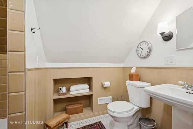 5747 W Grace St, Chicago, IL 60634 - bathroom with lofted ceiling and a wainscoted wall