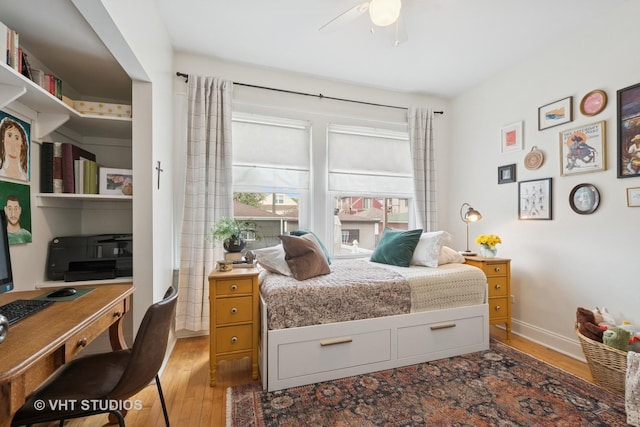 5747 W Grace St, Chicago, IL 60634 - bedroom with light wood-style flooring, an office area, and a ceiling fan