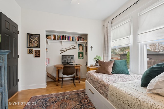 5747 W Grace St, Chicago, IL 60634 - bedroom featuring wood finished floors and a desk