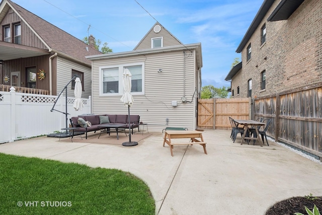 5747 W Grace St, Chicago, IL 60634 - back of house with an outdoor living space, a patio area, a fenced backyard, and outdoor dining area