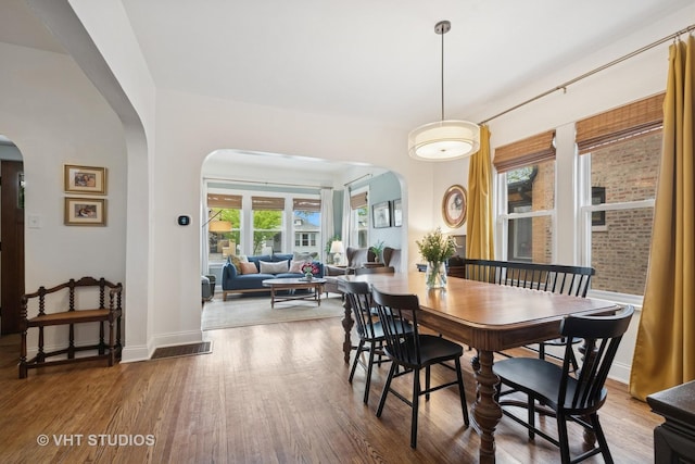 5747 W Grace St, Chicago, IL 60634 - dining room with arched walkways and wood finished floors