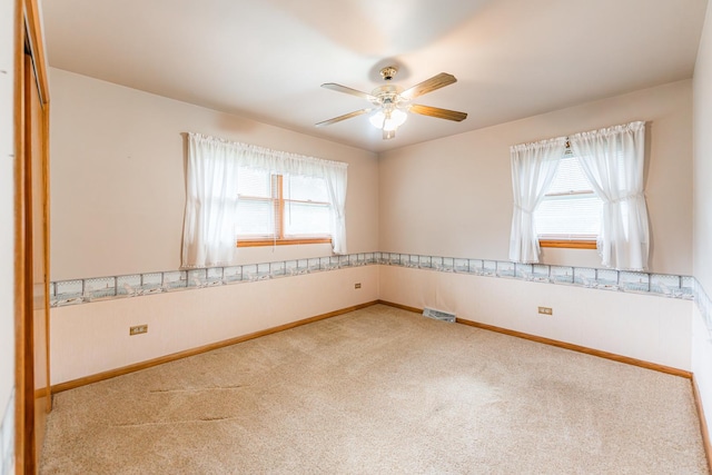 525 Bunning Dr, Downers Grove, IL 60516 - empty room with carpet flooring, plenty of natural light, and a ceiling fan