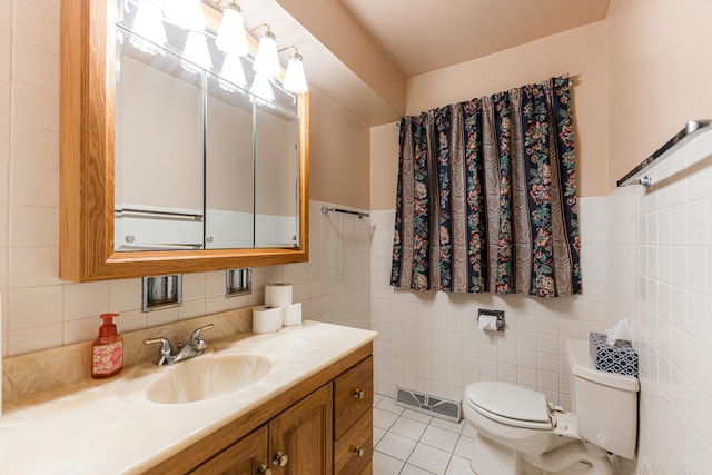 525 Bunning Dr, Downers Grove, IL 60516 - bathroom with tile walls, vanity, tile patterned floors, and wainscoting