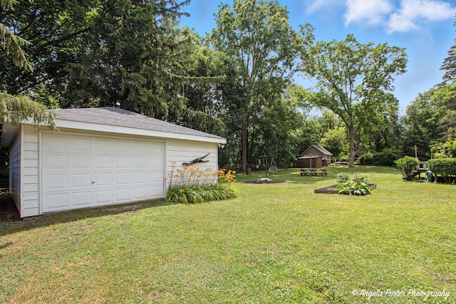 2514 Cuhlman Rd, Mchenry, IL 60051 - view of grassy yard featuring an outdoor structure, a garage, and view of scattered trees