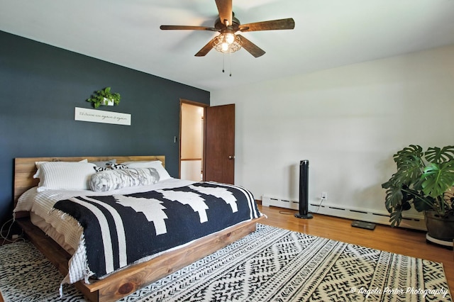 2514 Cuhlman Rd, Mchenry, IL 60051 - bedroom with a baseboard heating unit, wood finished floors, and a ceiling fan