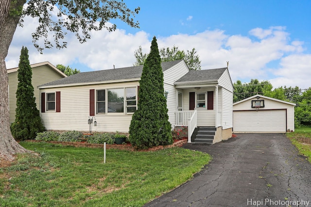 1912 Oak Dr, Mchenry, IL 60050 - view of front of property featuring a detached garage, an outdoor structure, a front lawn, and a shingled roof