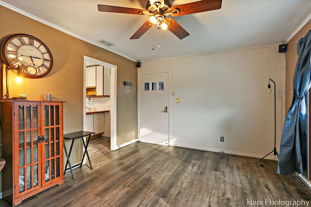 1912 Oak Dr, Mchenry, IL 60050 - foyer featuring ceiling fan, wood finished floors, and ornamental molding