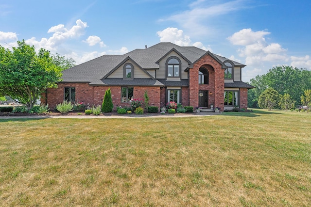 17642 Crystal Lake Dr, Homer Glen, IL 60491 - traditional-style house featuring a front lawn, brick siding, and roof with shingles