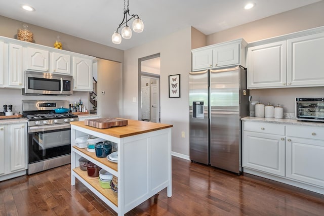 17642 Crystal Lake Dr, Homer Glen, IL 60491 - kitchen featuring appliances with stainless steel finishes, butcher block counters, white cabinetry, dark wood finished floors, and recessed lighting