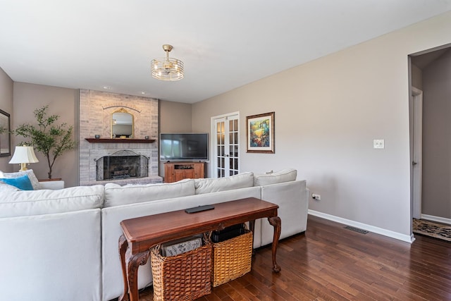 17642 Crystal Lake Dr, Homer Glen, IL 60491 - living room featuring dark wood-style floors, a fireplace, and a chandelier