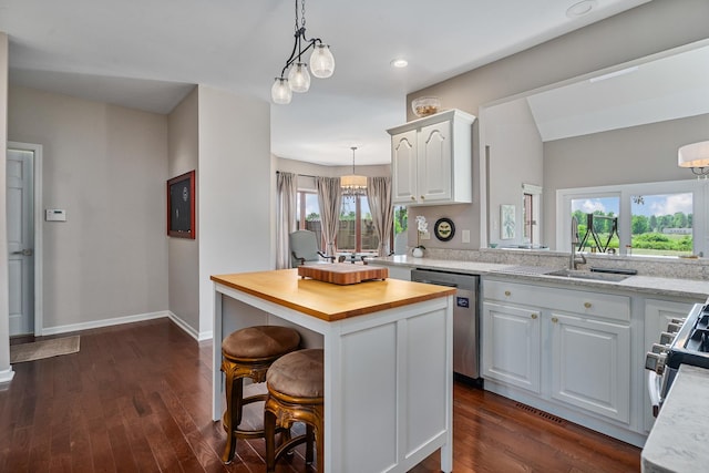 17642 Crystal Lake Dr, Homer Glen, IL 60491 - kitchen featuring butcher block countertops, stainless steel appliances, white cabinetry, pendant lighting, and a kitchen bar