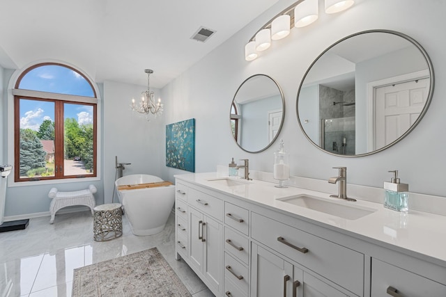 17642 Crystal Lake Dr, Homer Glen, IL 60491 - bathroom with double vanity, a tile shower, a freestanding tub, a chandelier, and marble finish flooring