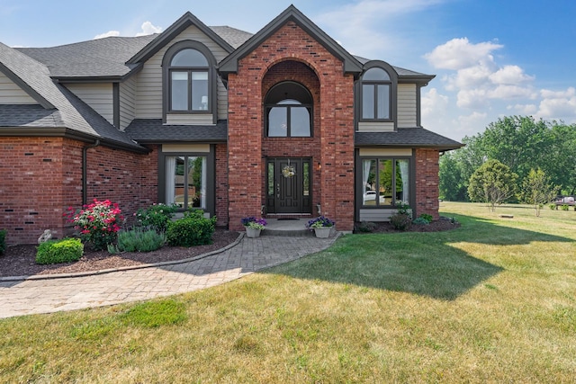 17642 Crystal Lake Dr, Homer Glen, IL 60491 - view of front facade with brick siding, a shingled roof, and a front yard