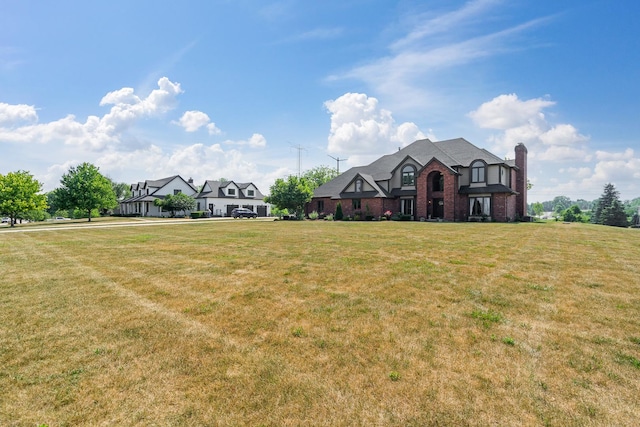 17642 Crystal Lake Dr, Homer Glen, IL 60491 - view of front facade featuring brick siding, a chimney, and a front lawn