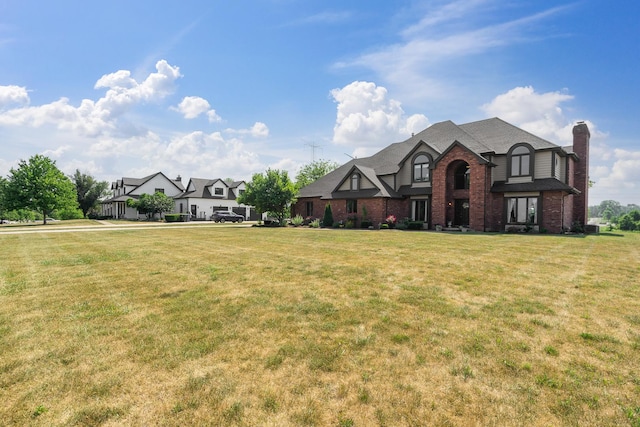 17642 Crystal Lake Dr, Homer Glen, IL 60491 - view of front facade with brick siding, a front lawn, and a chimney