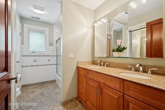 36 Logan Ter, Golf, IL 60029 - bathroom with tile walls, double vanity, and wainscoting
