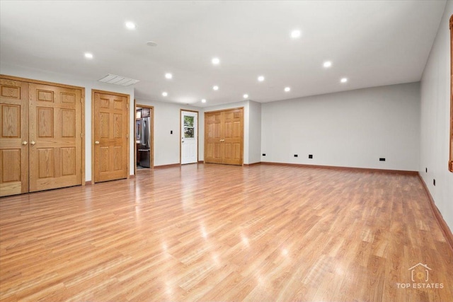 1702 Winthrop Ln, Schaumburg, IL 60193 - unfurnished living room with recessed lighting and light wood-style flooring