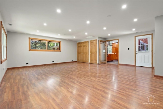 1702 Winthrop Ln, Schaumburg, IL 60193 - unfurnished living room with recessed lighting and light wood-style floors