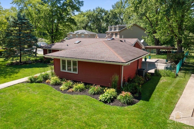 1702 Winthrop Ln, Schaumburg, IL 60193 - view of side of home featuring a shingled roof and a lawn