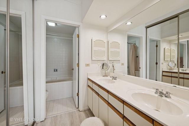 707 Sturnbridge Ln, Schaumburg, IL 60173 - full bath with a tile shower, double vanity, tiled bath, and recessed lighting